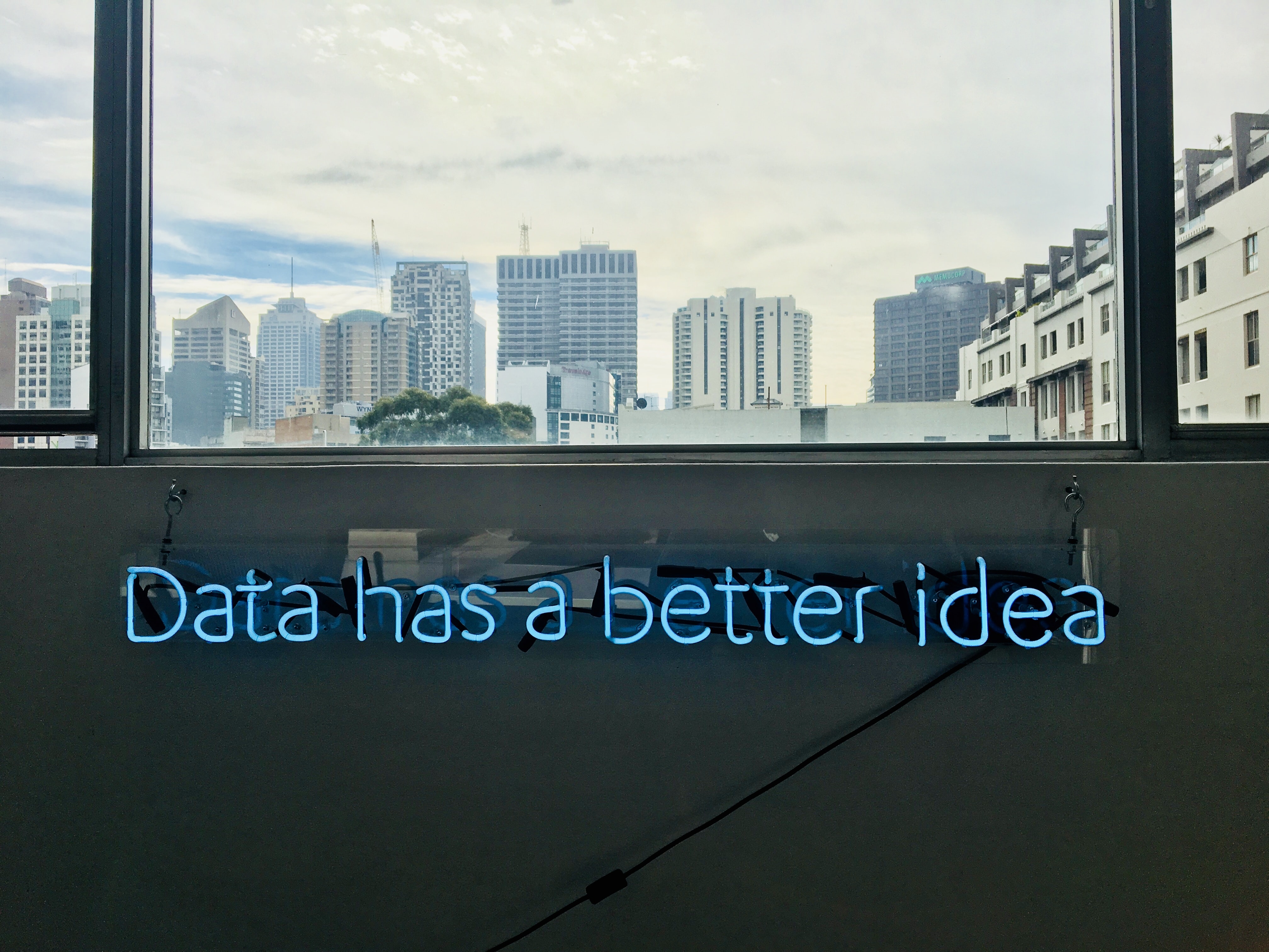 white building with data has a better idea writing